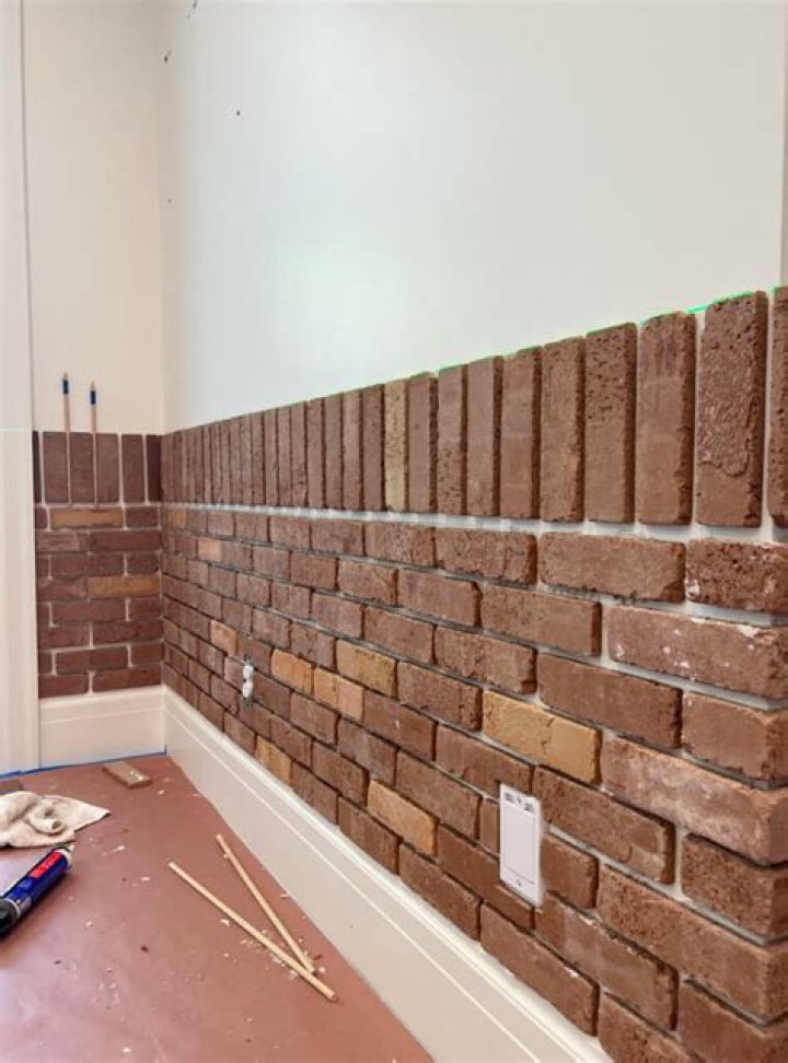 Can I put brick veneer over drywall?