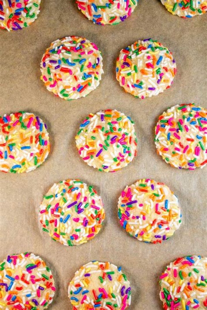 How do you get sprinkles to stick to cookies?